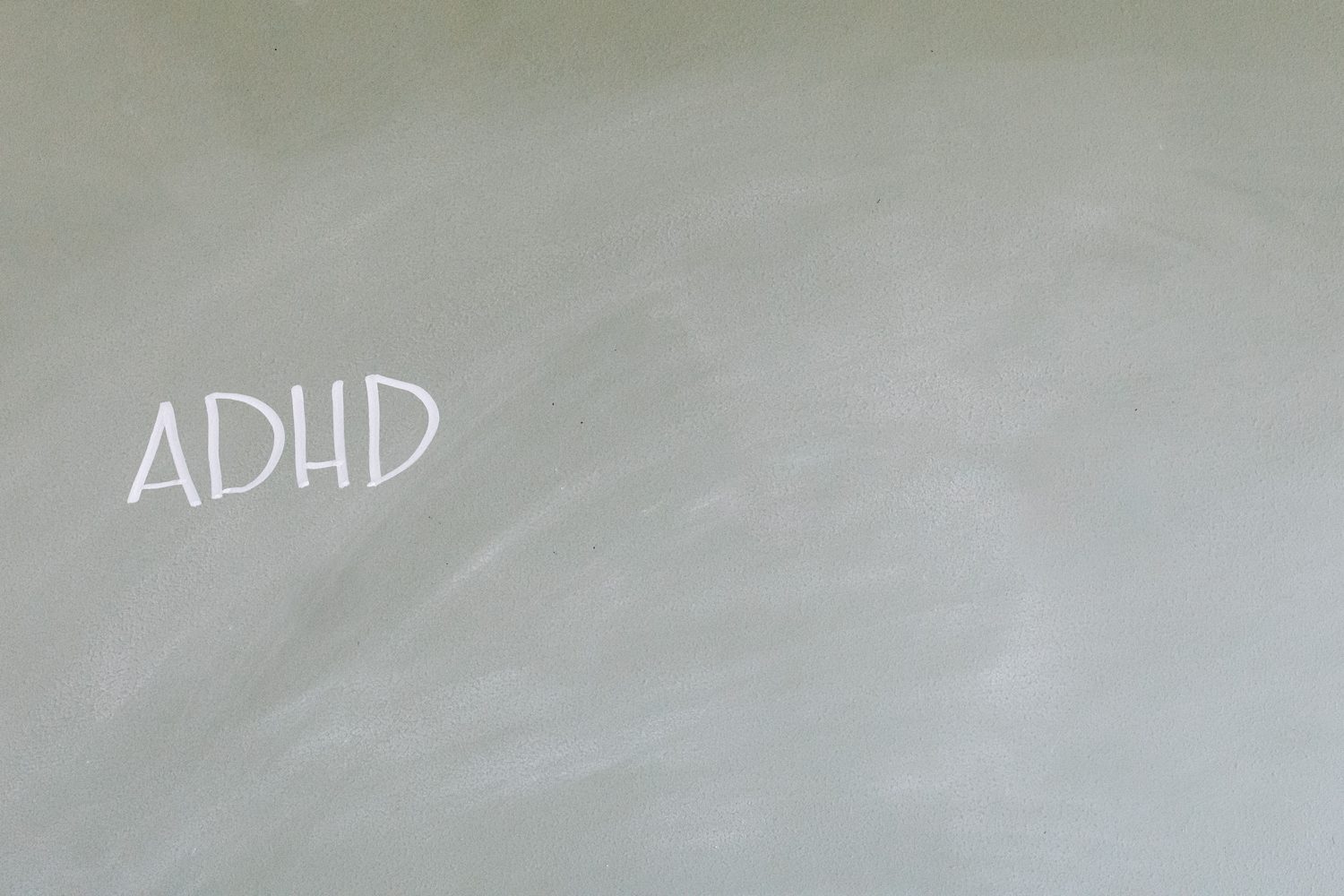 ADHD written in chalk on a green board